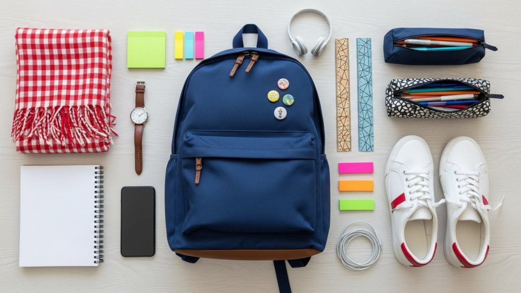 Back to School Outfits for High School | Trendy & Affordable Looks 7 School accessories flat lay with backpack and scarf.